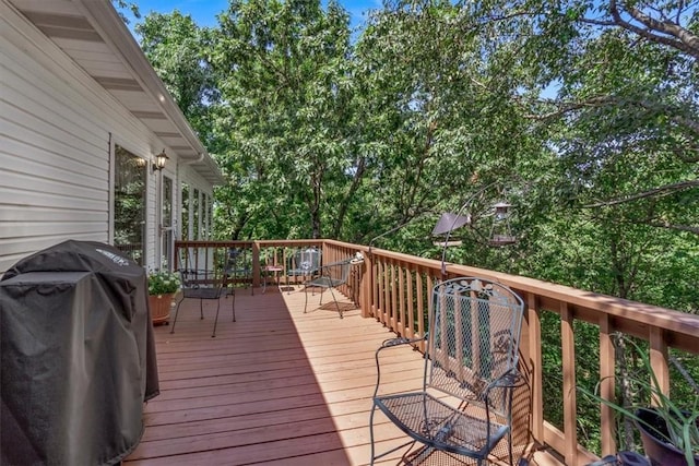 wooden terrace featuring grilling area