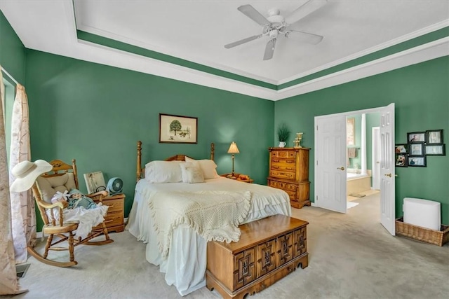 bedroom with carpet floors, ornamental molding, a ceiling fan, and ensuite bathroom