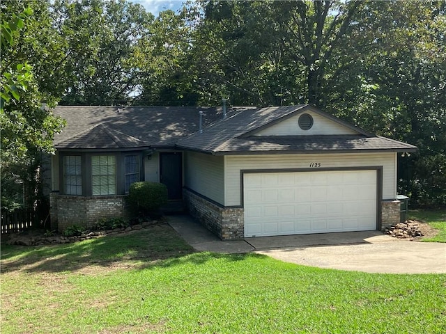 ranch-style house with a garage, a front lawn, concrete driveway, and brick siding