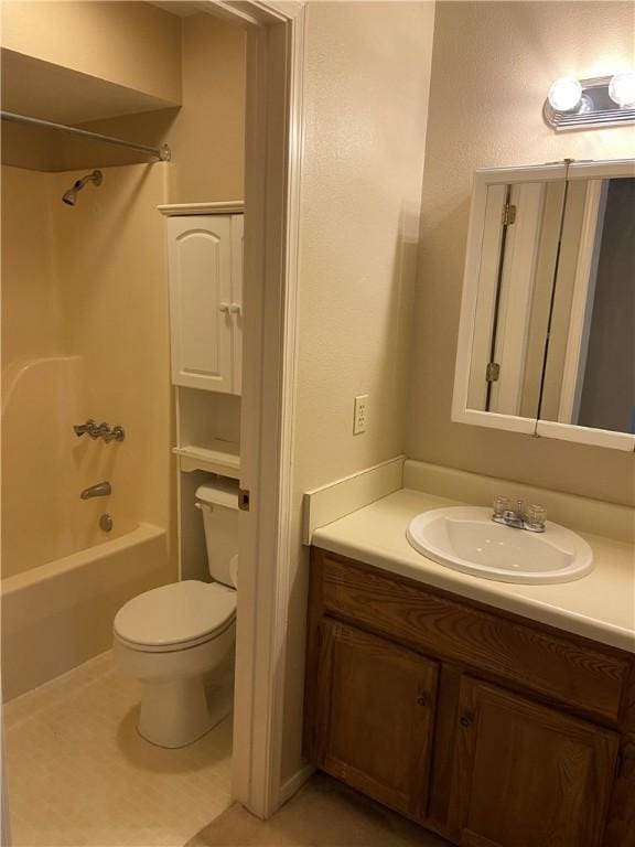 full bathroom featuring shower / bath combination, vanity, toilet, and tile patterned floors