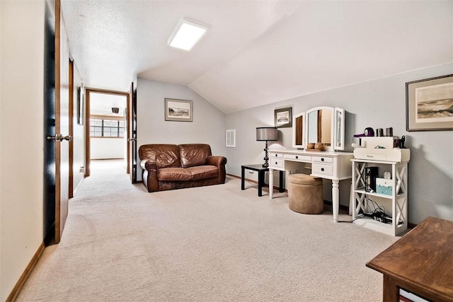 carpeted living room featuring lofted ceiling and baseboards