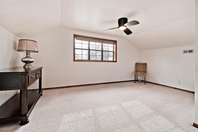 sitting room featuring lofted ceiling, carpet floors, a ceiling fan, visible vents, and baseboards