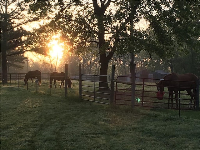 view of stable with a rural view