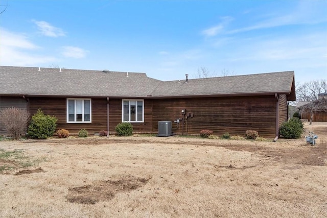 rear view of property featuring cooling unit