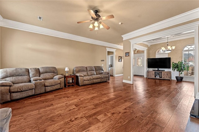 living room with hardwood / wood-style flooring, visible vents, ornamental molding, baseboards, and ceiling fan with notable chandelier