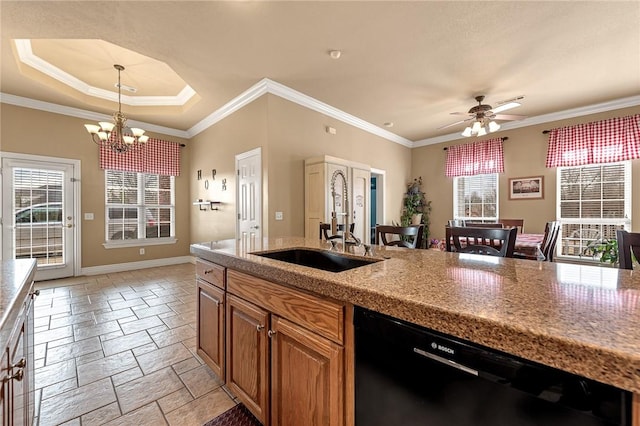 kitchen featuring a sink, a healthy amount of sunlight, stone tile flooring, and dishwasher