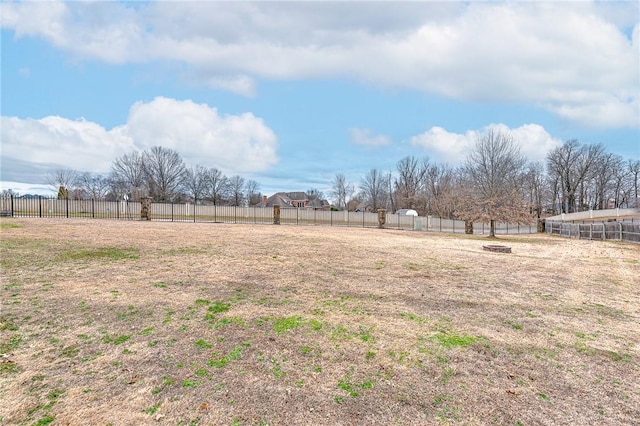 view of yard featuring a rural view and fence