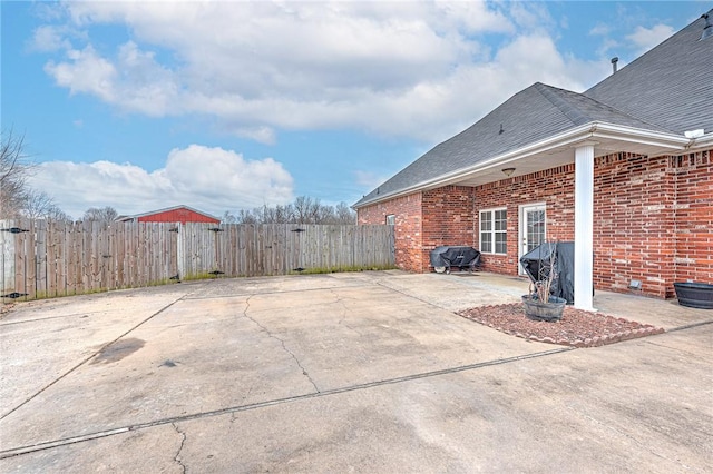 view of patio / terrace featuring area for grilling and fence