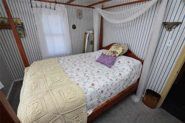 bedroom featuring carpet floors and wallpapered walls