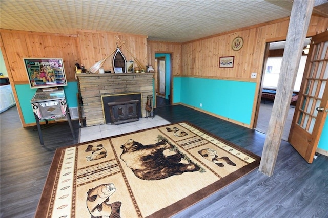 living area with wood walls and wood finished floors