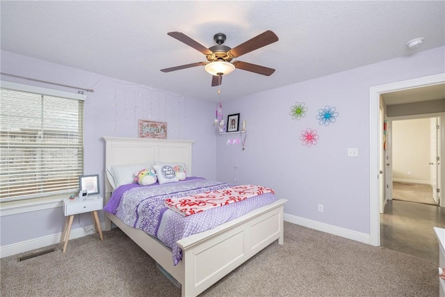 bedroom featuring visible vents, baseboards, a ceiling fan, and light colored carpet