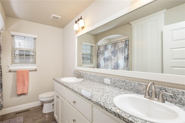 full bathroom featuring visible vents, a sink, and toilet