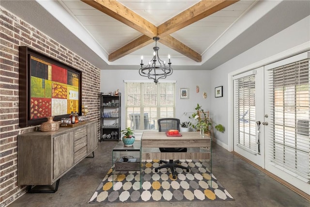 home office featuring brick wall, a wealth of natural light, and finished concrete floors