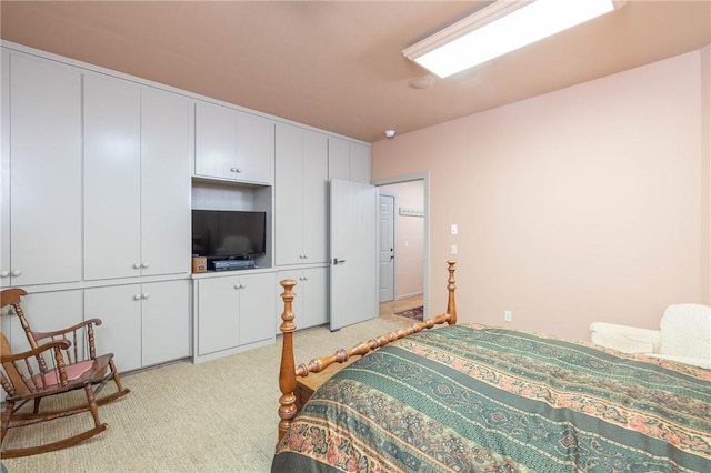 bedroom featuring light colored carpet