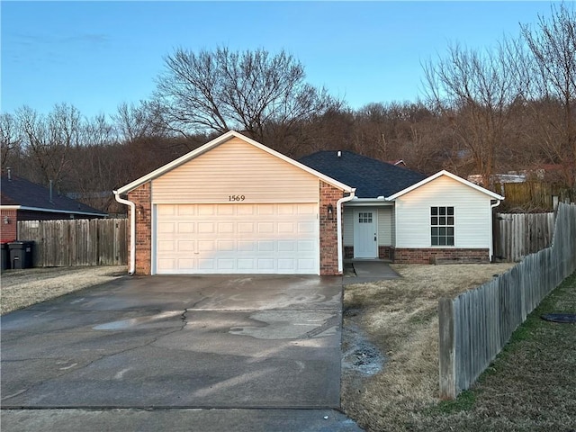 single story home with driveway, a garage, roof with shingles, fence, and brick siding