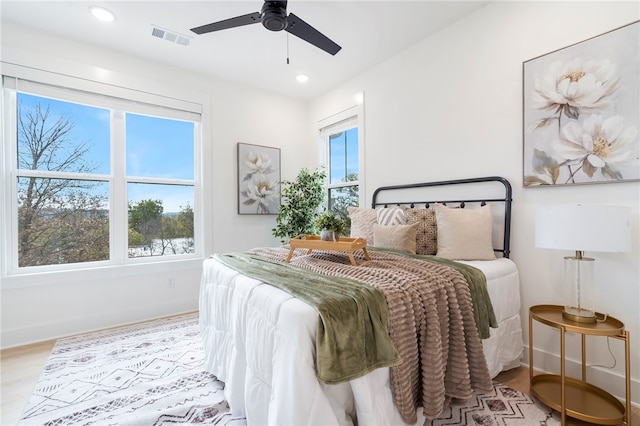 bedroom with baseboards, visible vents, a ceiling fan, wood finished floors, and recessed lighting