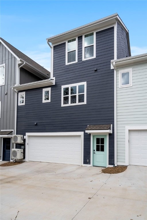 view of front of property with a garage and concrete driveway