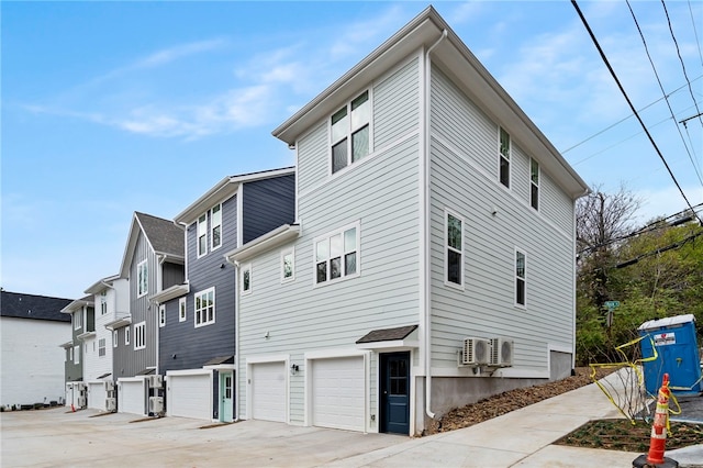 exterior space featuring driveway and an attached garage