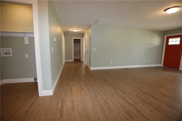 entryway with wood finished floors and baseboards