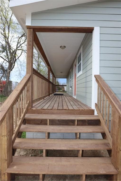 wooden terrace featuring stairs