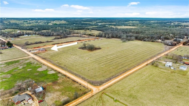 birds eye view of property with a rural view