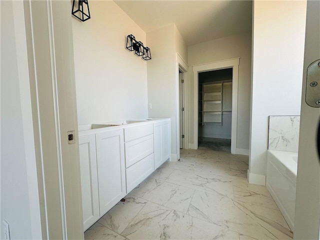 2550 Peterson Rd, Gentry, AR 72734 - full bathroom with baseboards, a closet, a bath, marble finish floor, and vanity