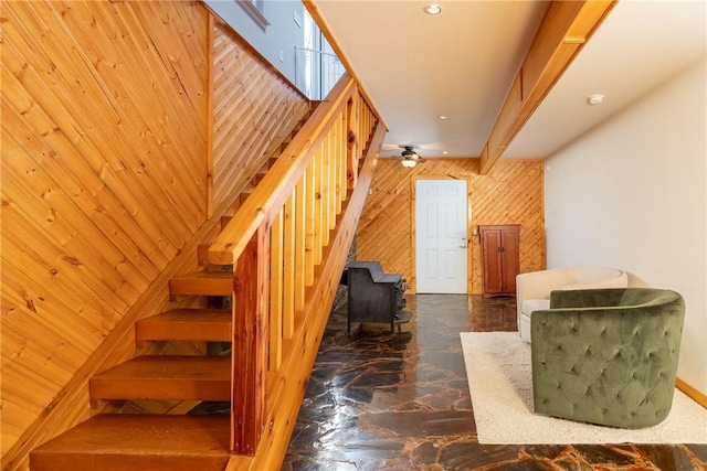 33 Rountree Dr, Bella Vista, AR 72715 - stairway featuring wooden walls, marble finish flooring, a wood stove, a ceiling fan, and recessed lighting