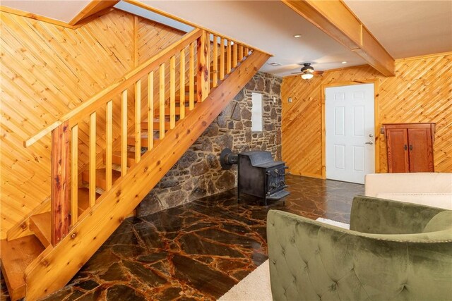 33 Rountree Dr, Bella Vista, AR 72715 - stairs featuring marble tiled flooring, wooden walls, a wood stove, beam ceiling, and a ceiling fan