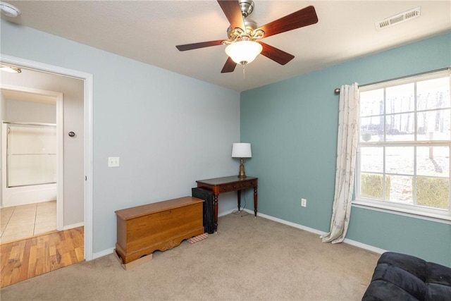 33 Rountree Dr, Bella Vista, AR 72715 - living area featuring carpet floors, baseboards, and ceiling fan