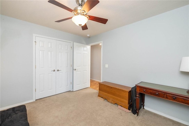 33 Rountree Dr, Bella Vista, AR 72715 - bedroom with light carpet, a ceiling fan, a closet, and baseboards