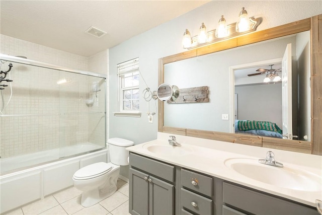 33 Rountree Dr, Bella Vista, AR 72715 - bathroom with tile patterned floors, toilet, double vanity, combined bath / shower with glass door, and ensuite bathroom