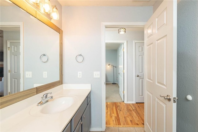 33 Rountree Dr, Bella Vista, AR 72715 - bathroom with vanity and wood finished floors