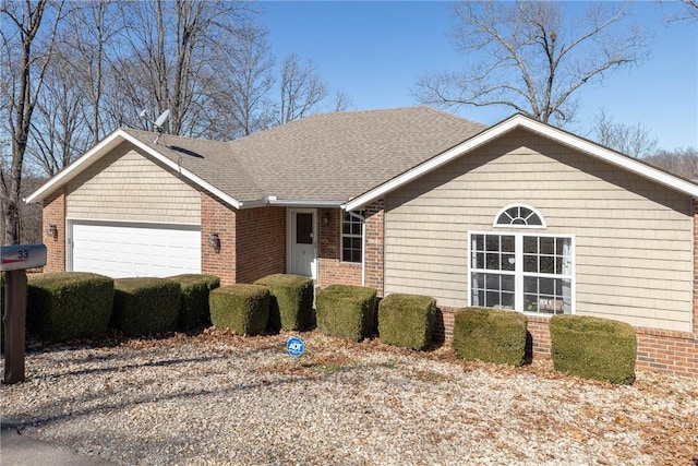 33 Rountree Dr, Bella Vista, AR 72715 - single story home featuring an attached garage, brick siding, a shingled roof, and driveway