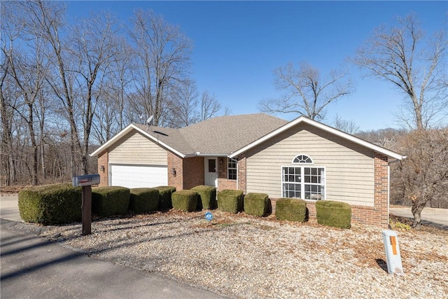33 Rountree Dr, Bella Vista, AR 72715 - ranch-style home featuring brick siding and a garage