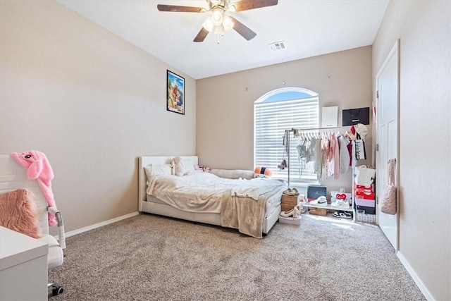 bedroom with a ceiling fan, baseboards, visible vents, and carpet flooring