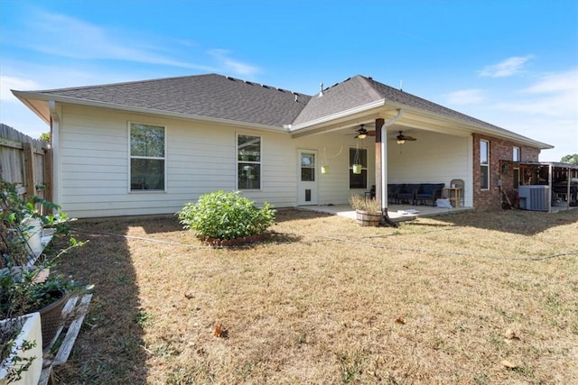 back of house featuring a yard, a patio area, fence, and a ceiling fan