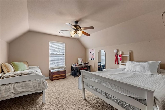 bedroom with lofted ceiling, ceiling fan, light carpet, visible vents, and baseboards