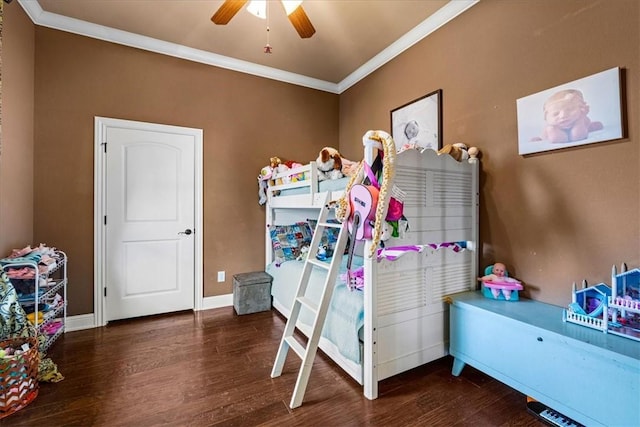 bedroom featuring baseboards, ornamental molding, ceiling fan, and wood finished floors