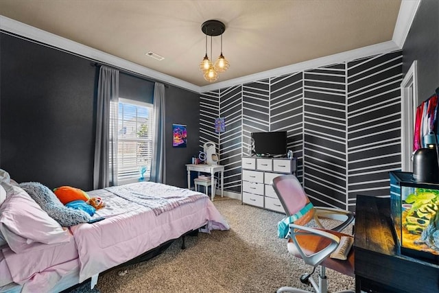 carpeted bedroom with visible vents and crown molding