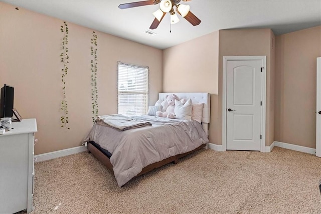 bedroom featuring light carpet, baseboards, visible vents, and ceiling fan