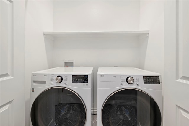 laundry room with laundry area and separate washer and dryer