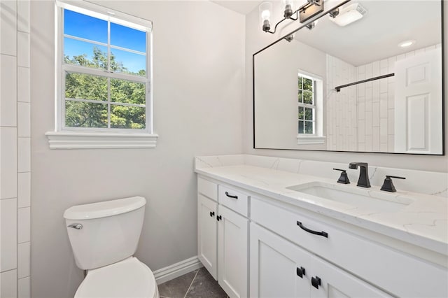 full bath with baseboards, a shower, toilet, tile patterned floors, and vanity