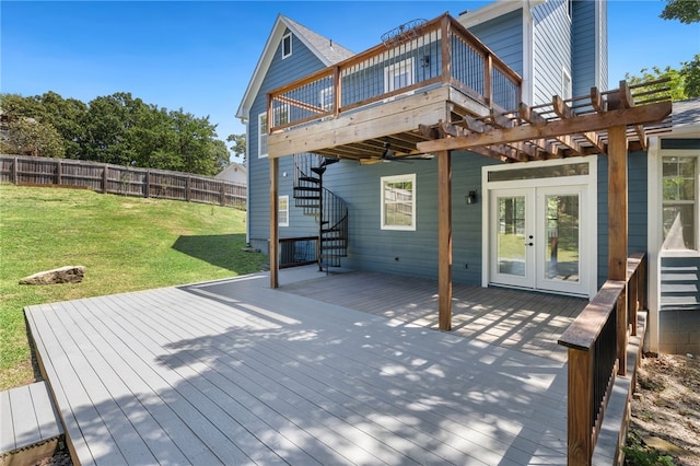 wooden terrace featuring stairway, fence, a lawn, and french doors