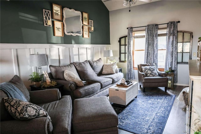 living room with a ceiling fan and wood finished floors