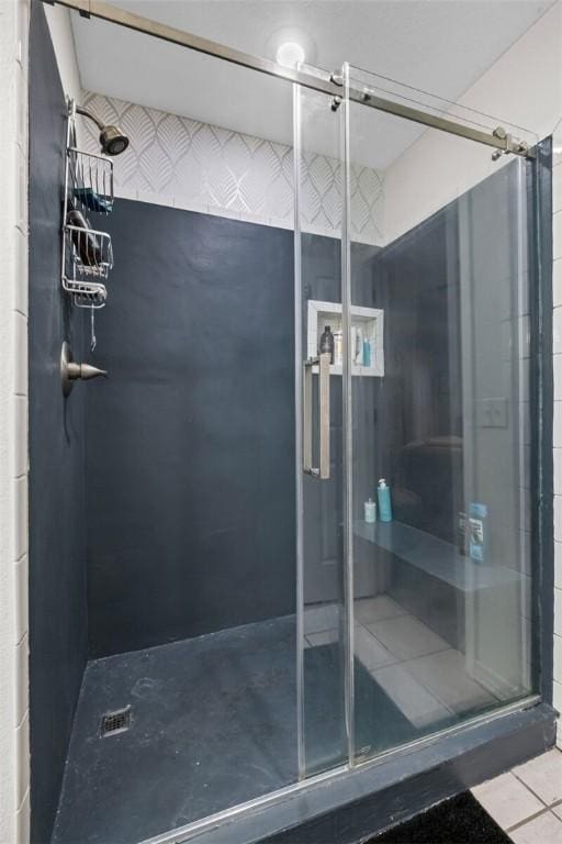 full bathroom with a shower stall and tile patterned floors