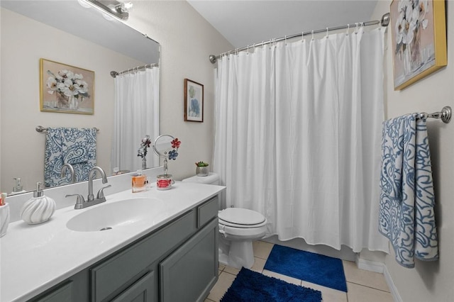 bathroom featuring toilet, vanity, and tile patterned floors