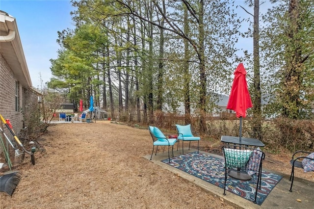 view of yard with a patio area