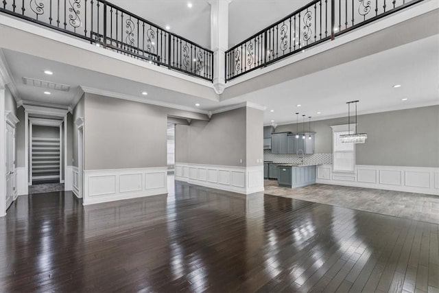 living room featuring recessed lighting, visible vents, stairway, ornamental molding, and wood finished floors