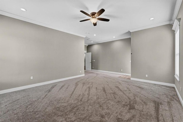 empty room with light carpet, ornamental molding, recessed lighting, and baseboards