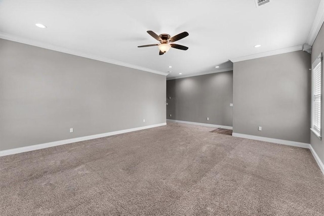 carpeted spare room with a ceiling fan, recessed lighting, crown molding, and baseboards